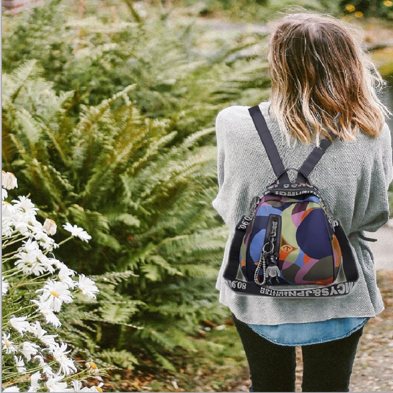 girl wearing a colorful backpack bag