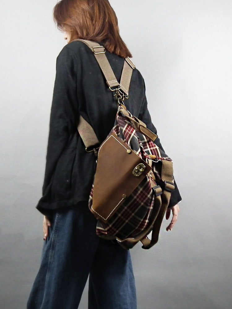 model carrying plaid backpack 
