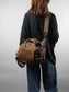 model carrying plaid messenger bag crossbody style