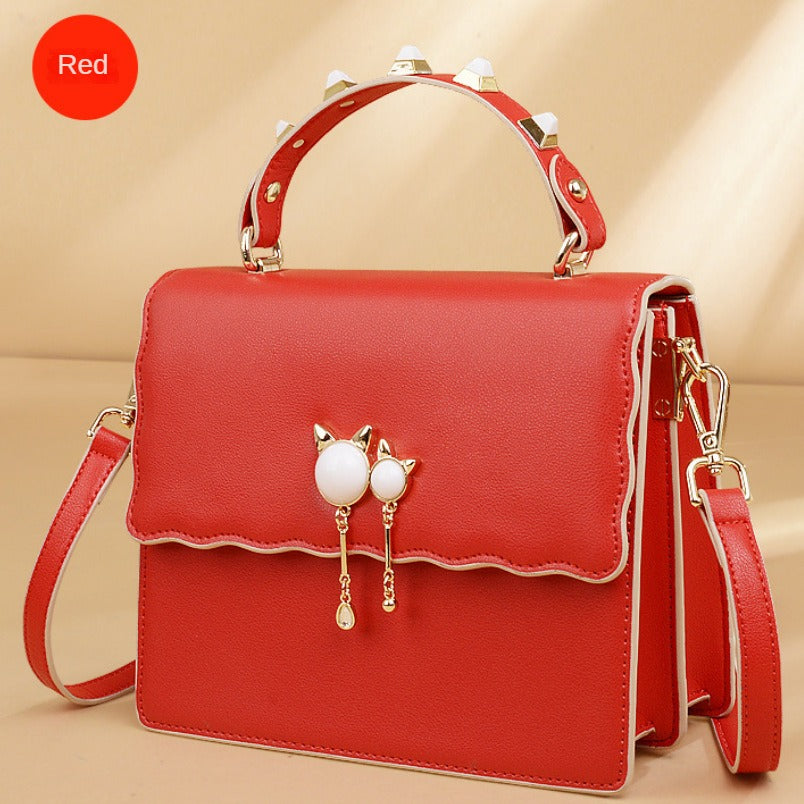 red cat ornament handbag